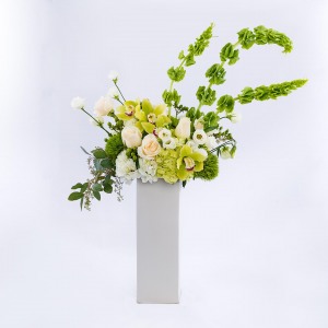 Product shoot of green and white floral arrangement