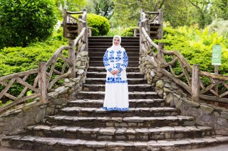 Muslim tourist in summer hijab in Central Park