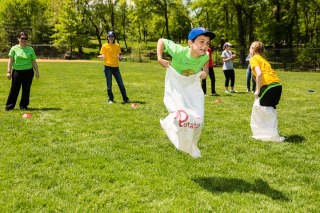 Potato sack race on field day in Central Park
