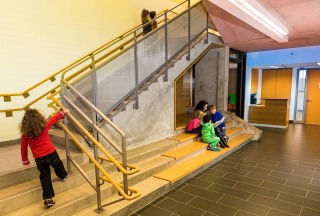 Student climbing stairs at school