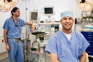 Surgeons in scrubs prep for surgery