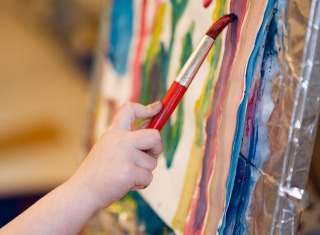 Closeup of young artists painting