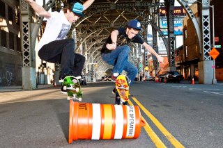 NYC skateboarders on Riverside Drive jumping barrels